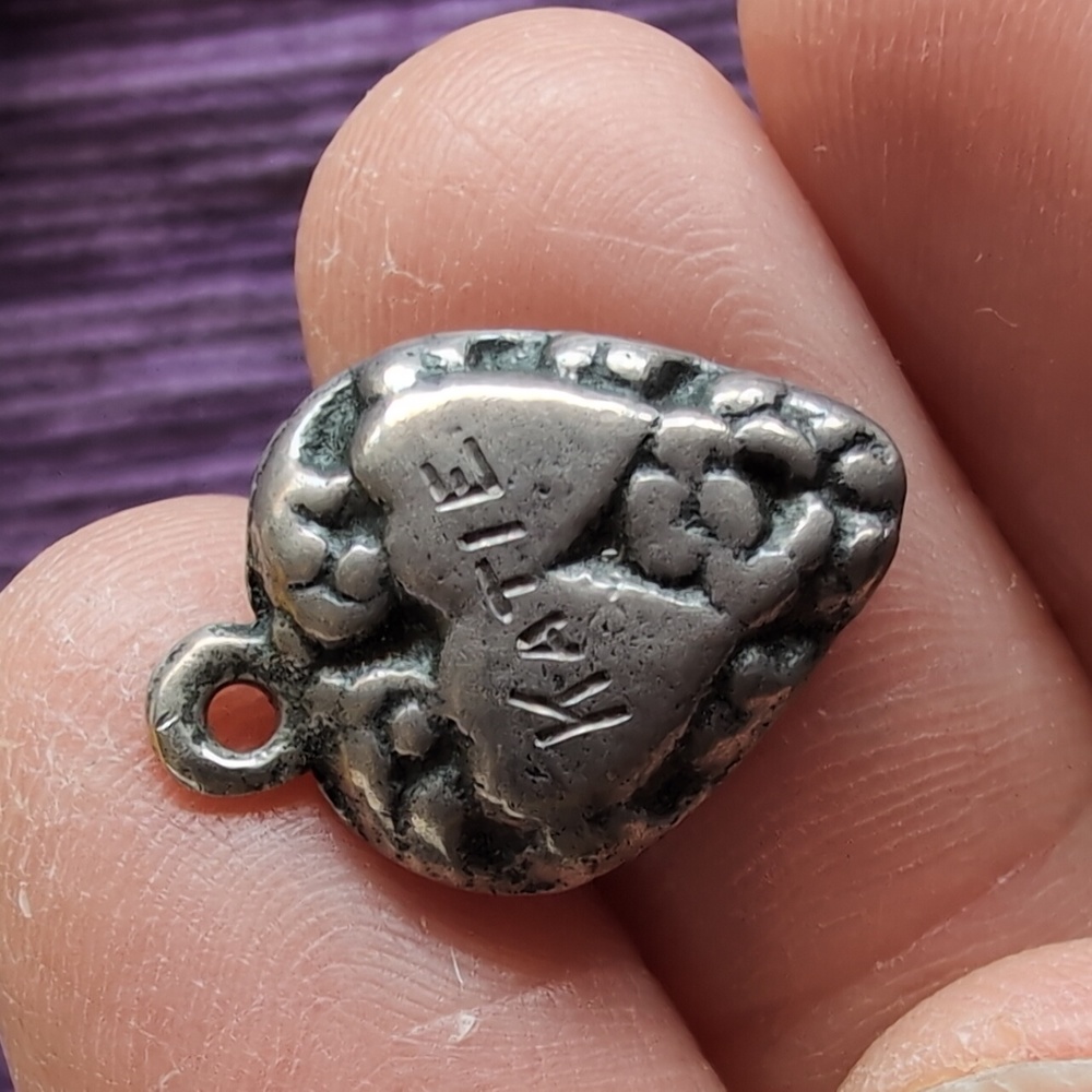 Antique sterling silver puffed heart charm